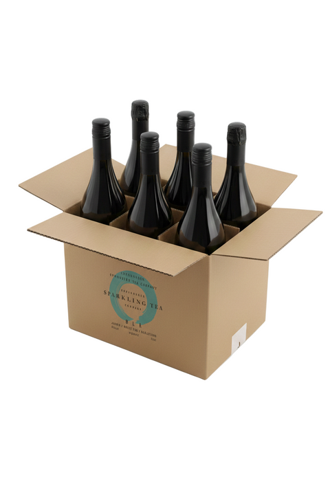 Cardboard box with six bottles of sparkling wine on a white background